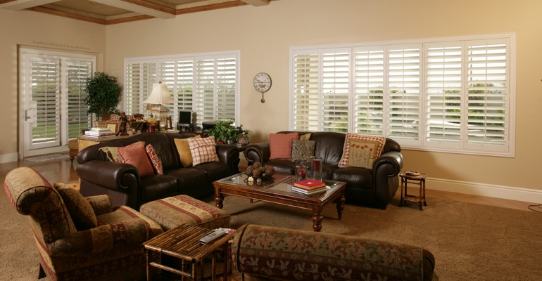 Detroit sunroom with white shutters.